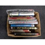 A box of books including musicals,