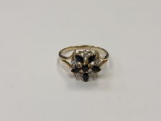 A 10ct gold diamond and sapphire cluster ring, 2.8g, size N/O.