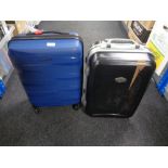 A hardshell luggage case , in new condition and one further similar case.