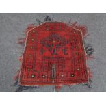 A small Afghan fringed mat,