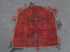A small Afghan fringed mat,