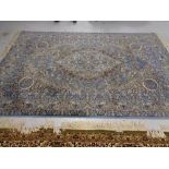 A machined Indian design carpet on blue ground,