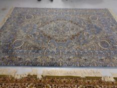 A machined Indian design carpet on blue ground,