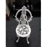 A cast metal patio chair