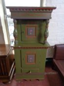 A nineteenth century painted cabinet fitted with cupboards