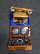 A radio alarm clock together with a traditional style telephone