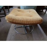 A mid century upholstered footstool