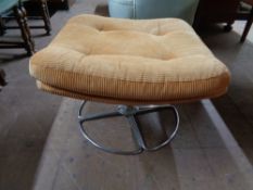 A mid century upholstered footstool