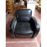 A black leather armchair CONDITION REPORT: 80cm wide by 90cm deep by 79cm high.