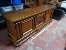 An early twentieth century carved oak low sideboard CONDITION REPORT: 210cm wide by