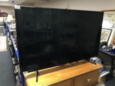 An LG 43 inch LCD TV with remote
