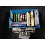 A box of books including Michael Palin,