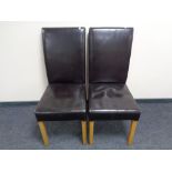 A pair of brown leather high backed dining chairs