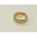 A 9ct gold band ring, size T CONDITION REPORT: 5.