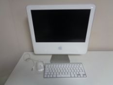 An Apple IMac with keyboard and mouse