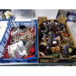 Two crates of costume jewellery,