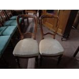 A pair of nineteenth century dining chairs