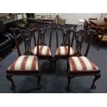 A set of four Victorian style Hepplewhite dining chairs