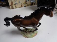 A Beswick figure of a cantering horse, model 1374.