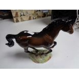 A Beswick figure of a cantering horse, model 1374.