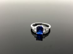 A Sterling silver Art Deco style square cut ring set with a blue stone, size N.