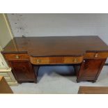 A George III mahogany breakfront twin pedestal sideboard with plate glass top CONDITION