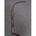 A nineteenth century leather and brass mounted whip