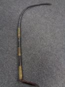 A nineteenth century leather and brass mounted whip