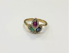 A 10ct gold ruby, sapphire, emerald and diamond ring, size M/N.