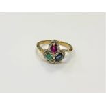 A 10ct gold ruby, sapphire, emerald and diamond ring, size M/N.