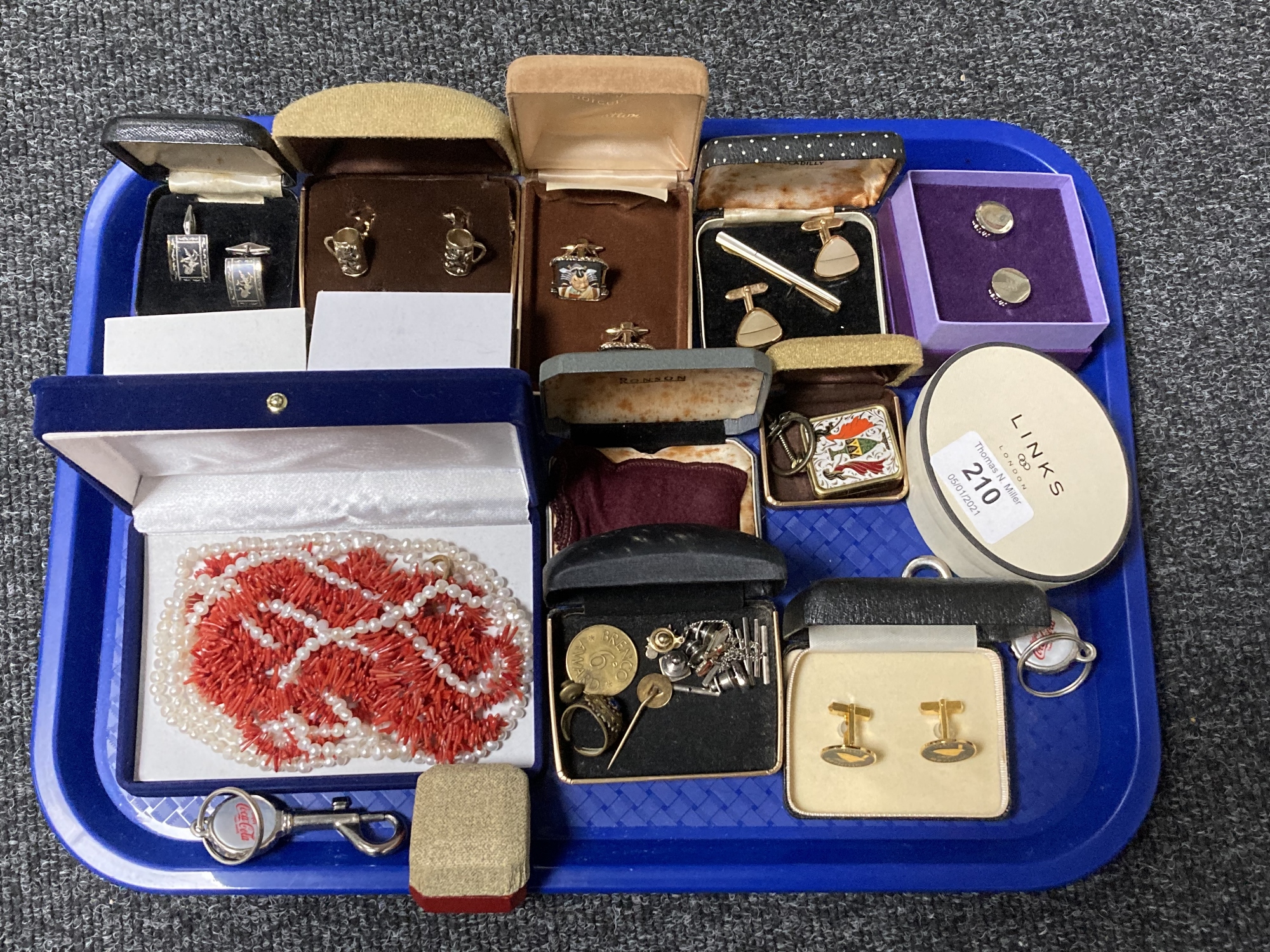 A collection of costume jewellery, cufflinks, coral necklace etc.