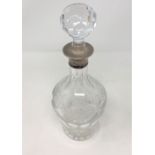 A good quality silver mounted decanter engraved with grapes and vines