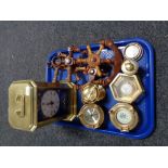 A reproduction Submarine brass clock together with nautical replicas of clocks etc