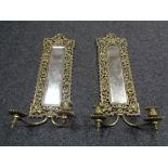 A pair of ornate brass framed mirrors with candles sconces (Af)