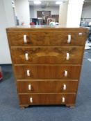 A 1930's walnut five drawer chest