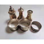 Six small pieces of silver including pepper pot, napkin rings etc.