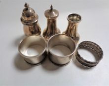 Six small pieces of silver including pepper pot, napkin rings etc.