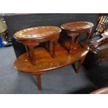 An oval eastern style coffee table with brass inlay together with pair of matching side tables