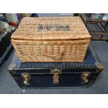A wicker basket together with a vintage trunk