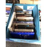 A box of books including Andy McNab, Patricia Cornwell,