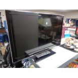 A Panasonic 32 inch LCD TV with remote