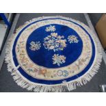 A fringed Chinese blue ground rug