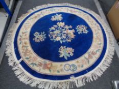 A fringed Chinese blue ground rug