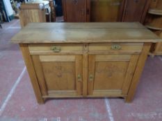 An early twentieth century carved oak sideboard CONDITION REPORT: 130cm wide by