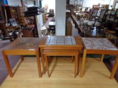 A nest of tables with tiled tops together with two lamp tables