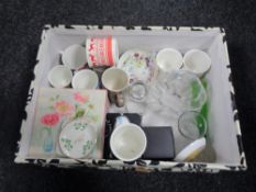 A crate of ceramics and glass including Royal Doulton Snowman collection mugs,