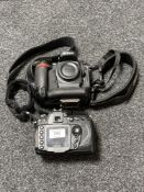 A Nikon D200 digital camera, body only, with lens cap, with strap.