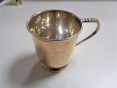 A small silver christening mug, Walker & Hall, Sheffield 1958, 92.9g.