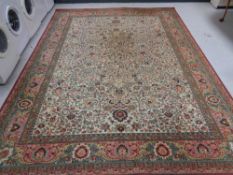 A machined Tabriz design carpet,