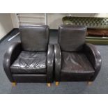 A pair of contemporary brown leather armchairs